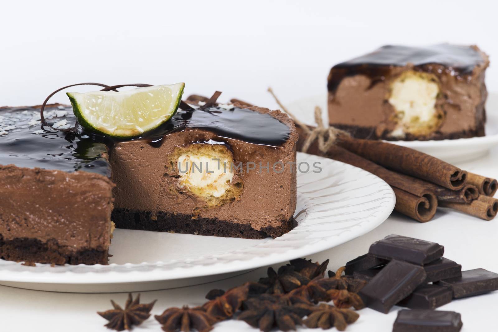 Chocolate souffle cake with eclair inside on a plate on light background