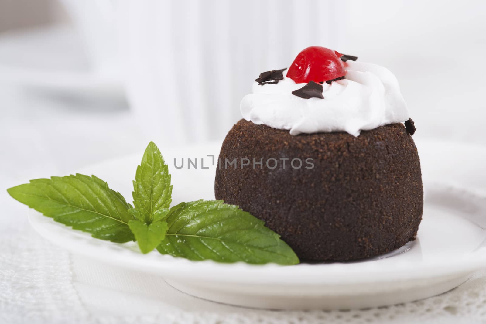 Chocolate sweet cake "Potato" on a plate on table, selective focus