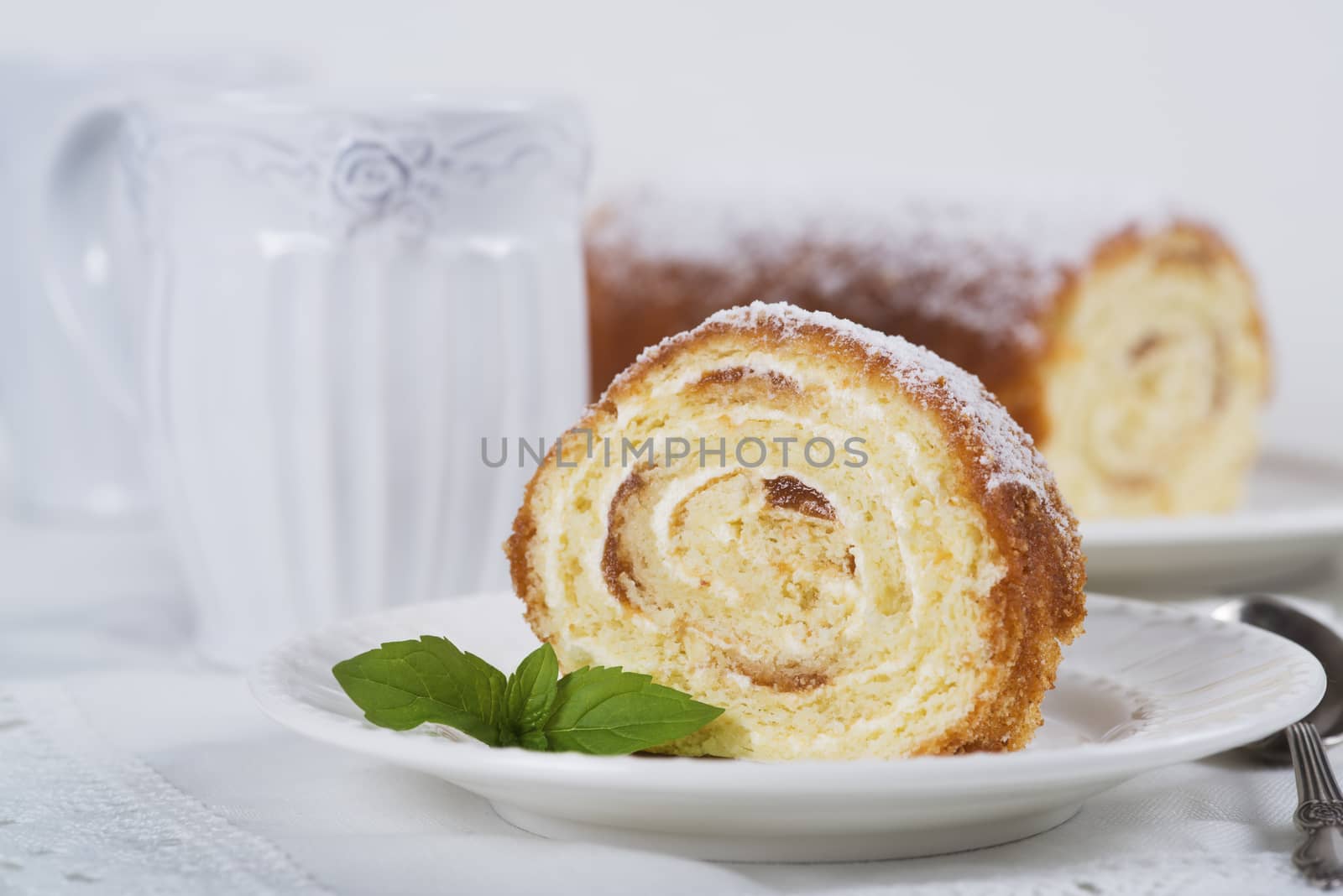 Biscuit roll with jam on a table, selective focus