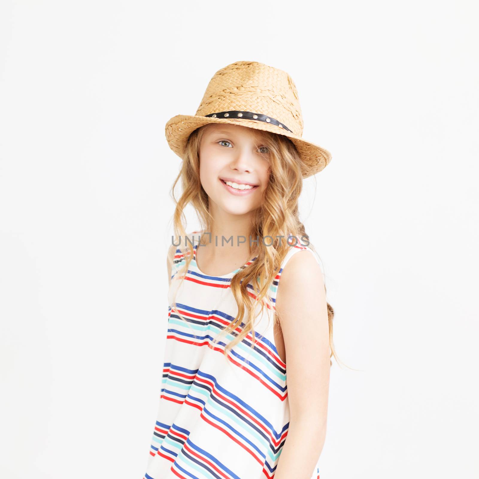 Lovely little girl with straw hat against a white background. by natazhekova