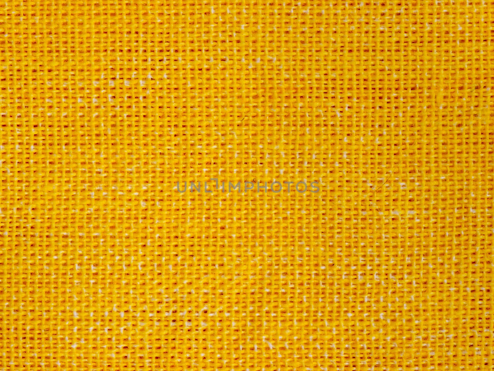 Natural yellow cotton fabric weaving close up as background texture