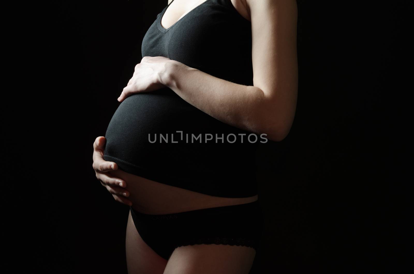 midsection of pregnant woman by Andreua