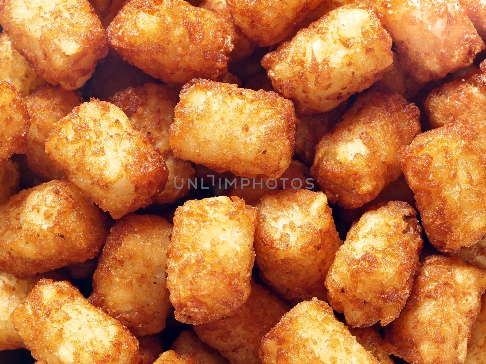 rustic golden potato tater tots food background by zkruger