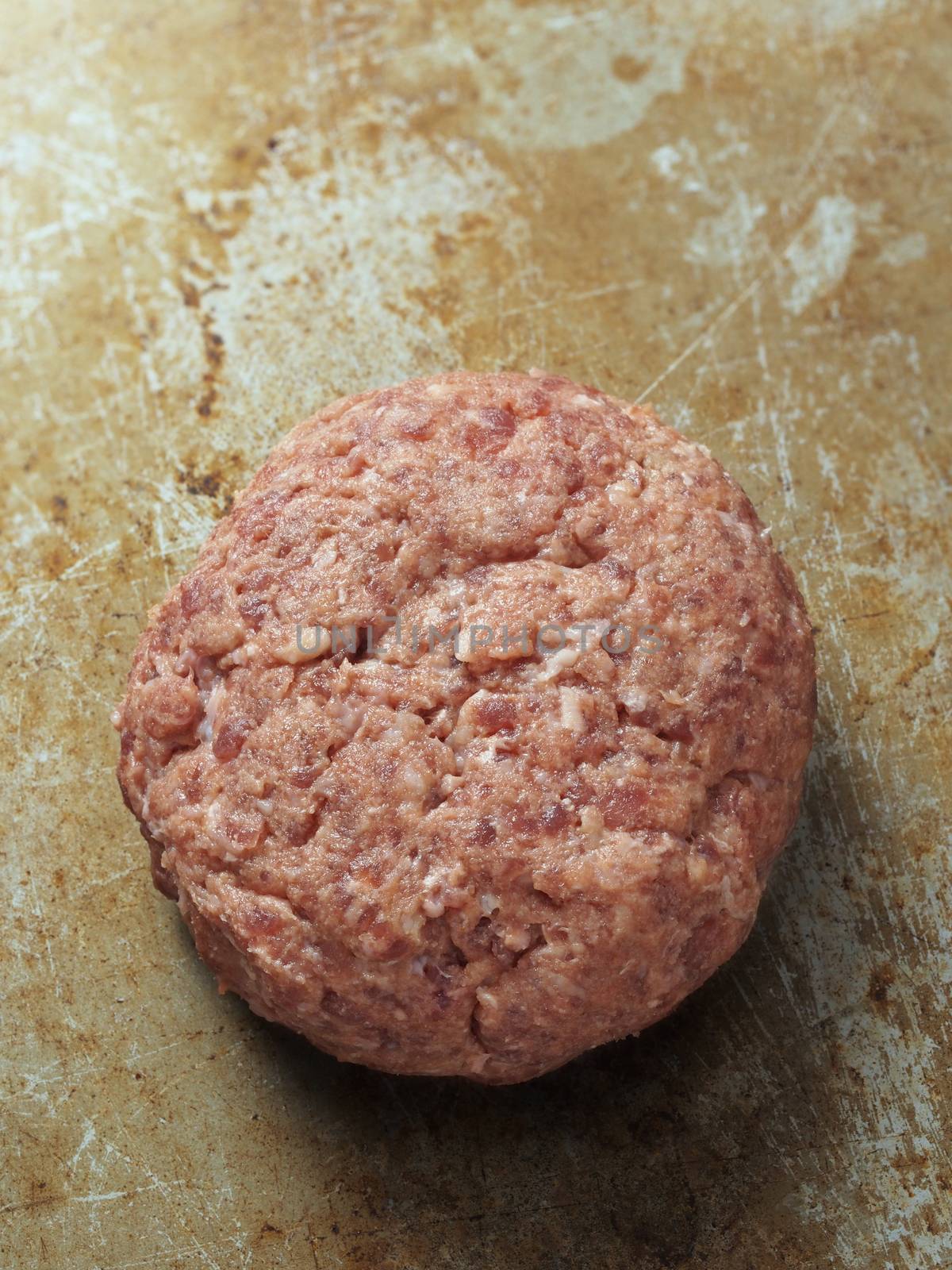 close up of rustic uncooked hamburger patty