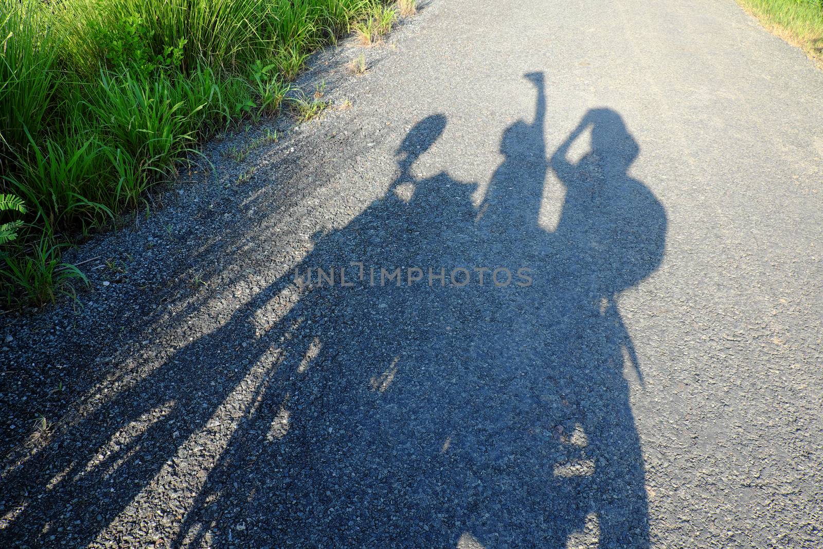 Amazing silhouette of couple on countryside road, summer  journey of backpacker of motorcycle to adventure Vietnam landscape, strong man ride motor on street, Asia couple travel together by motorbike