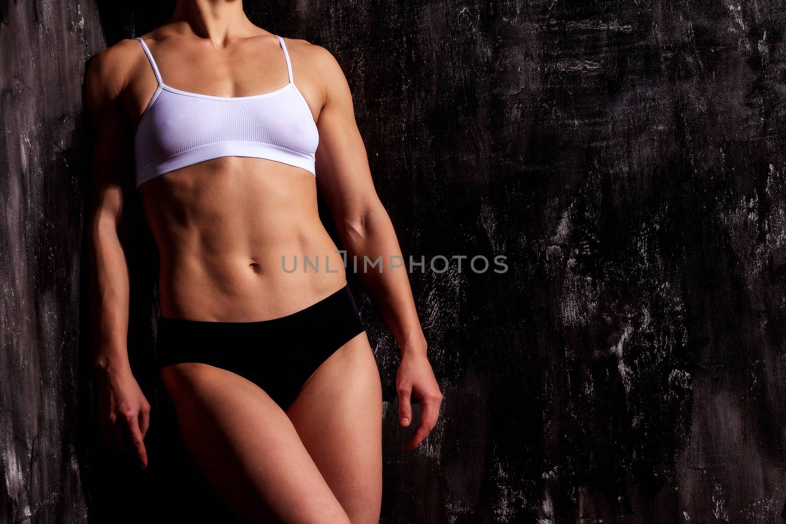Strong woman on a dark background