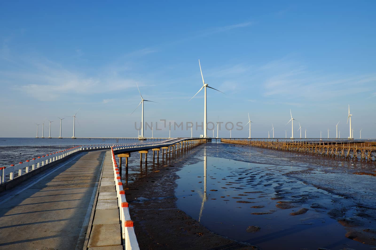 Group of wind turbines of Bac Lieu wind power plant at Mekong Delta, Vietnam. Windmill at Baclieu seaside at morning, make clean energy for Viet nam industry