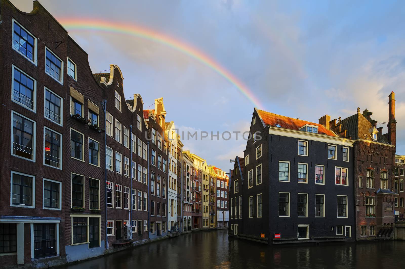 Amsterdam canal with rainbow by vwalakte