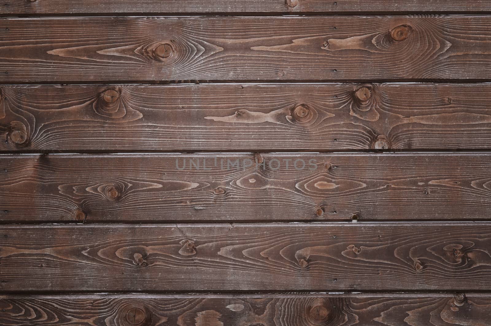 Natural background of wood with annual rings and knots.