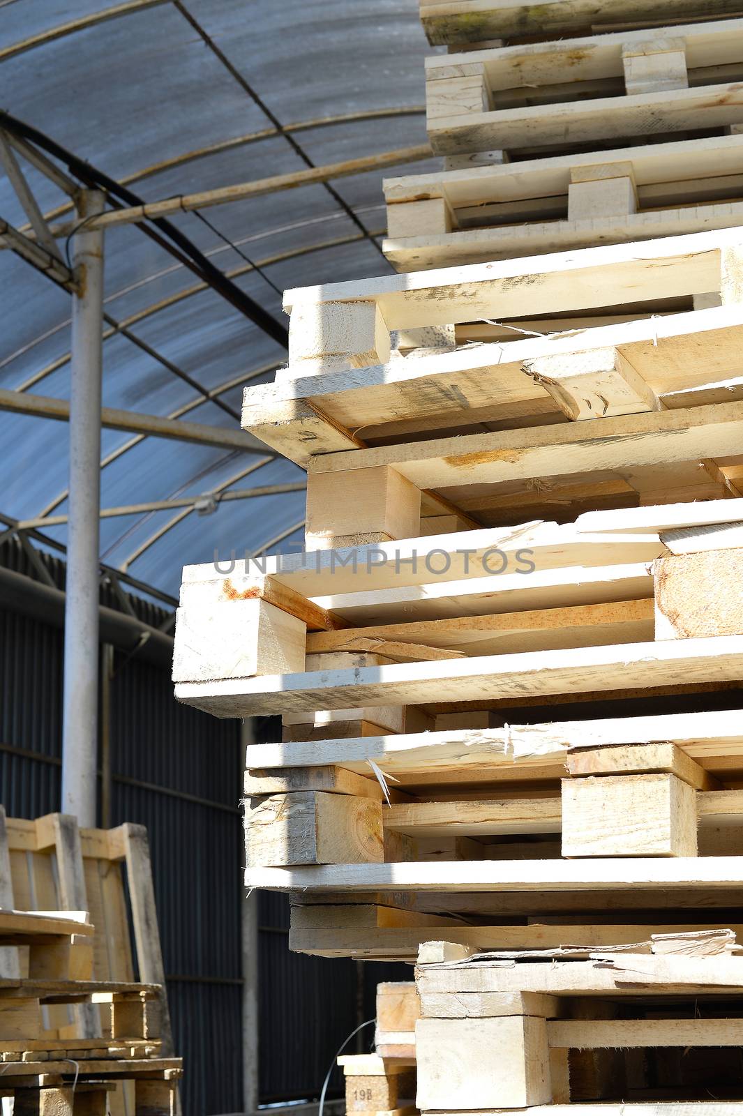 Waste wood from pallets stacked in the storage room.