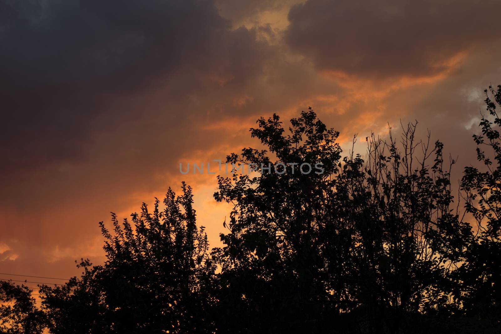 Dramatic and moody pink, purple and blue cloudy sunset sky