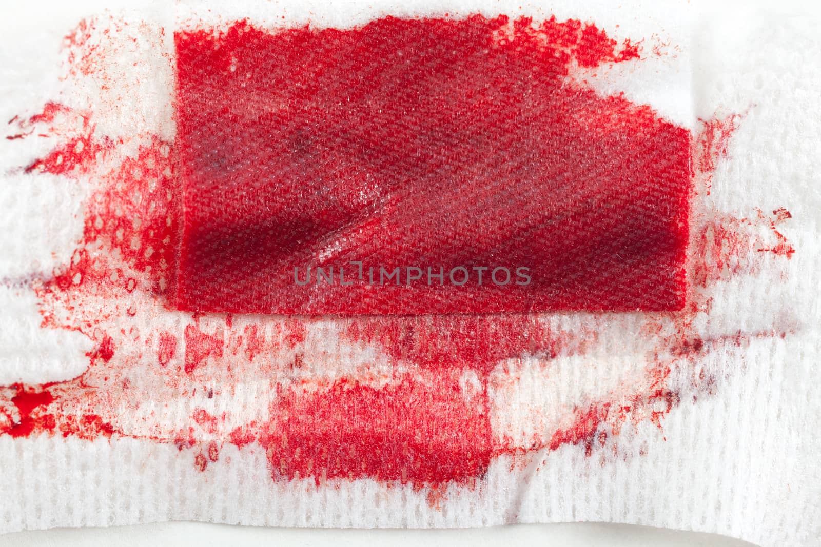 Gauze with blood on white background