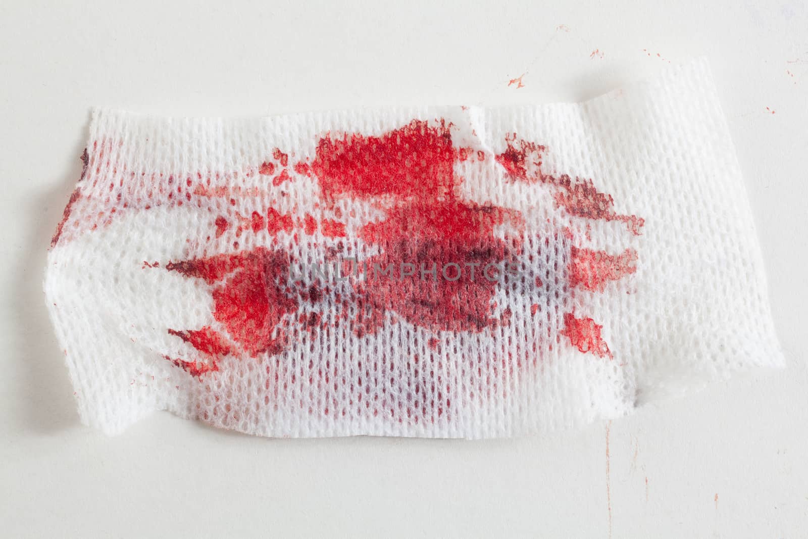 Gauze with blood on white background