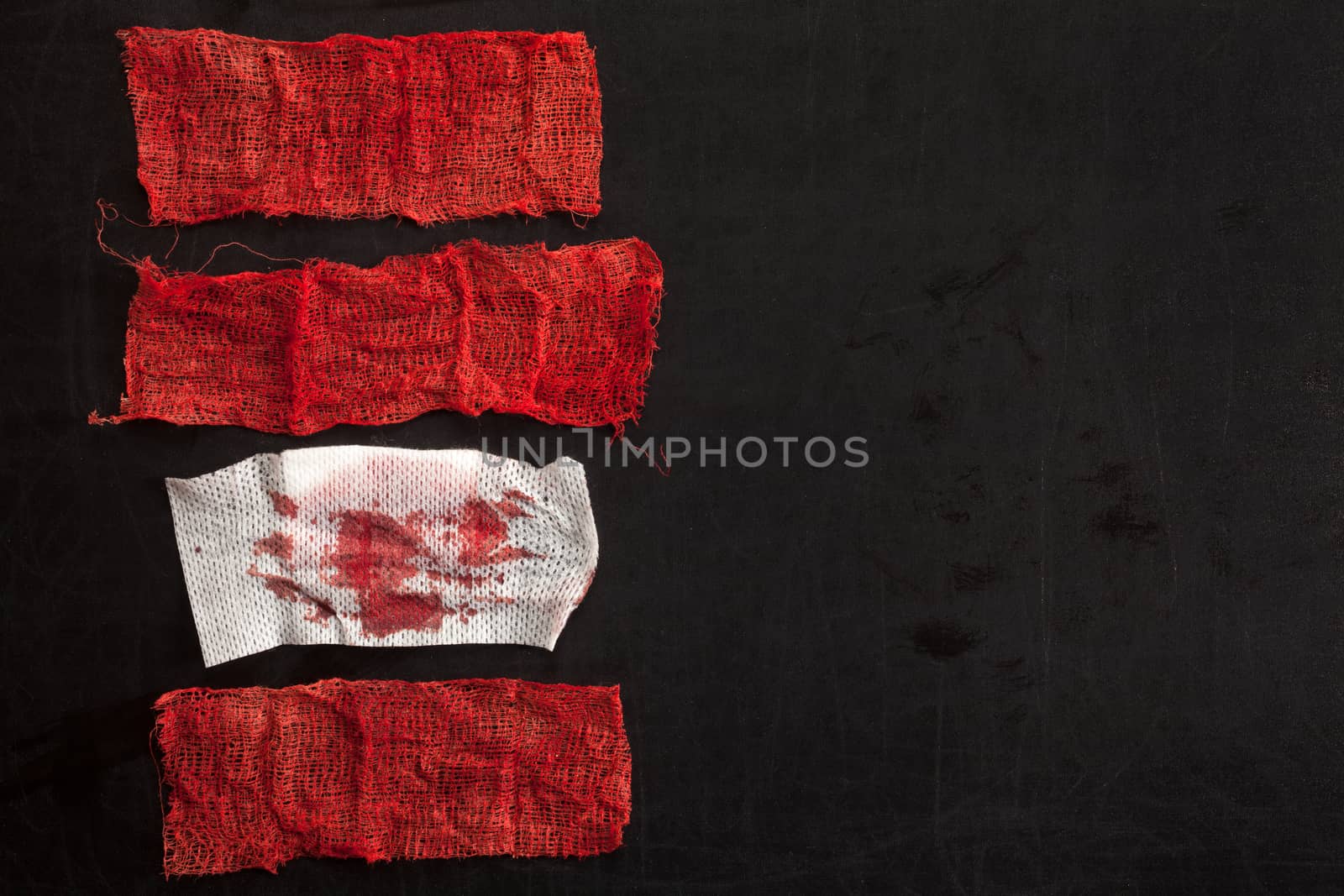 Gauze with blood on black background
