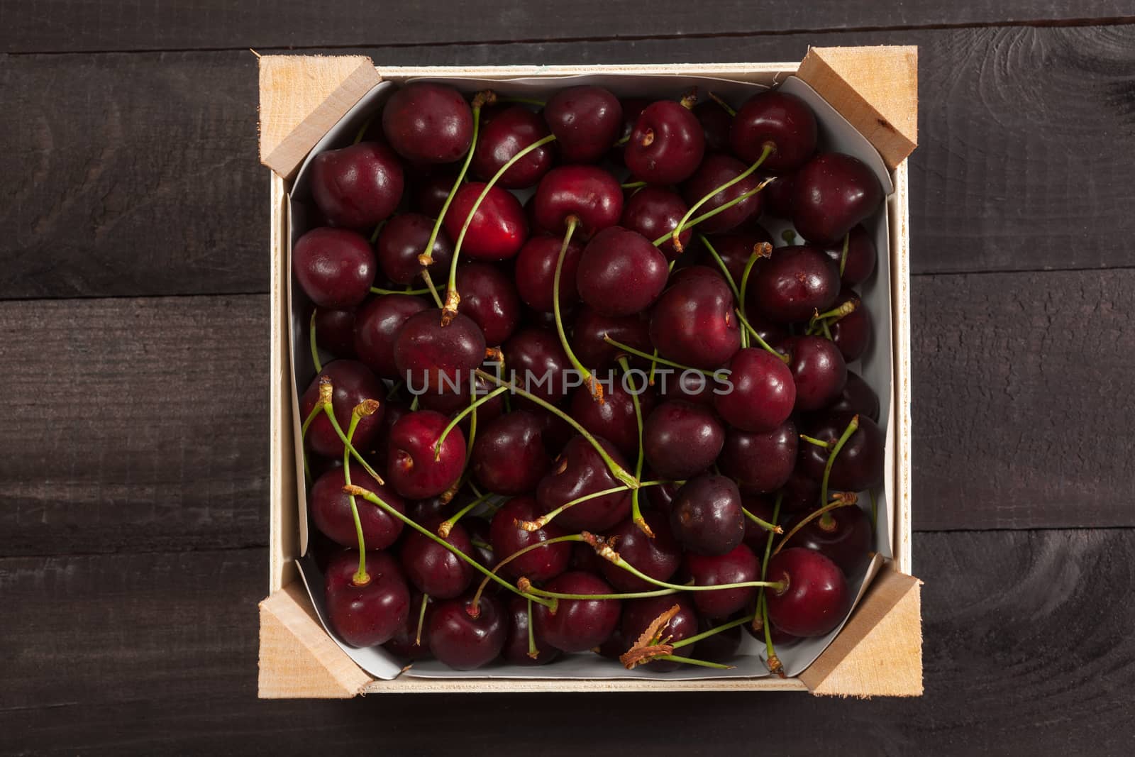 Cherries in a box by Portokalis