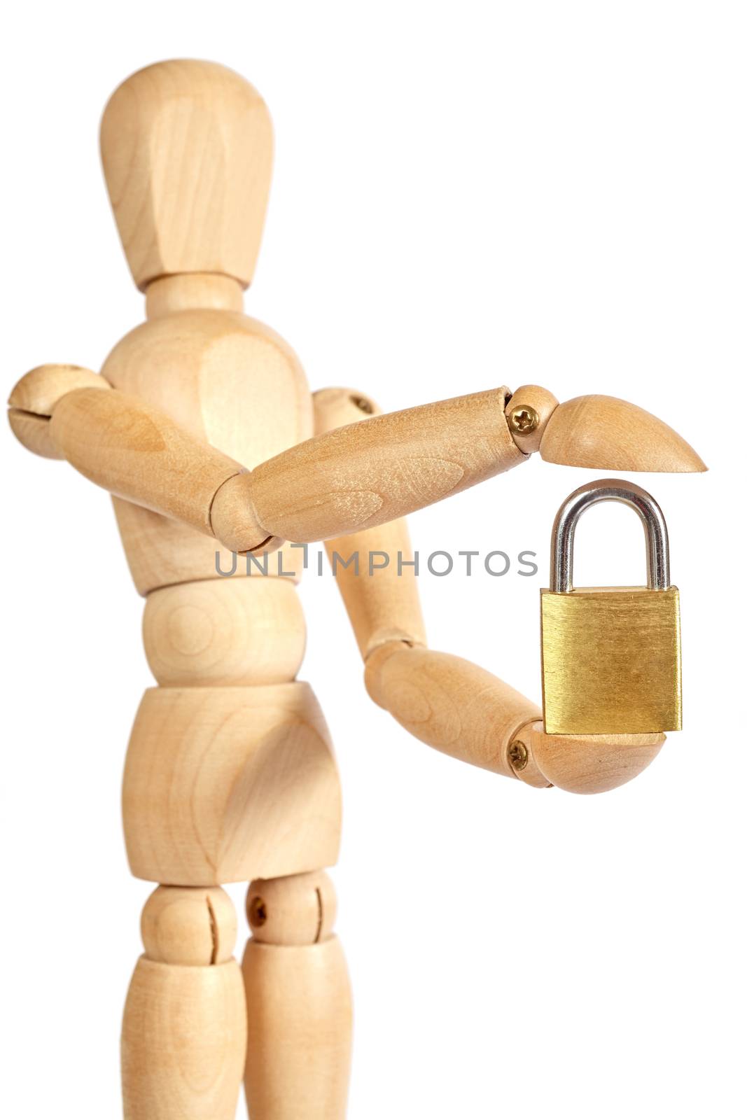 Wooden puppet holds small padlock on white background