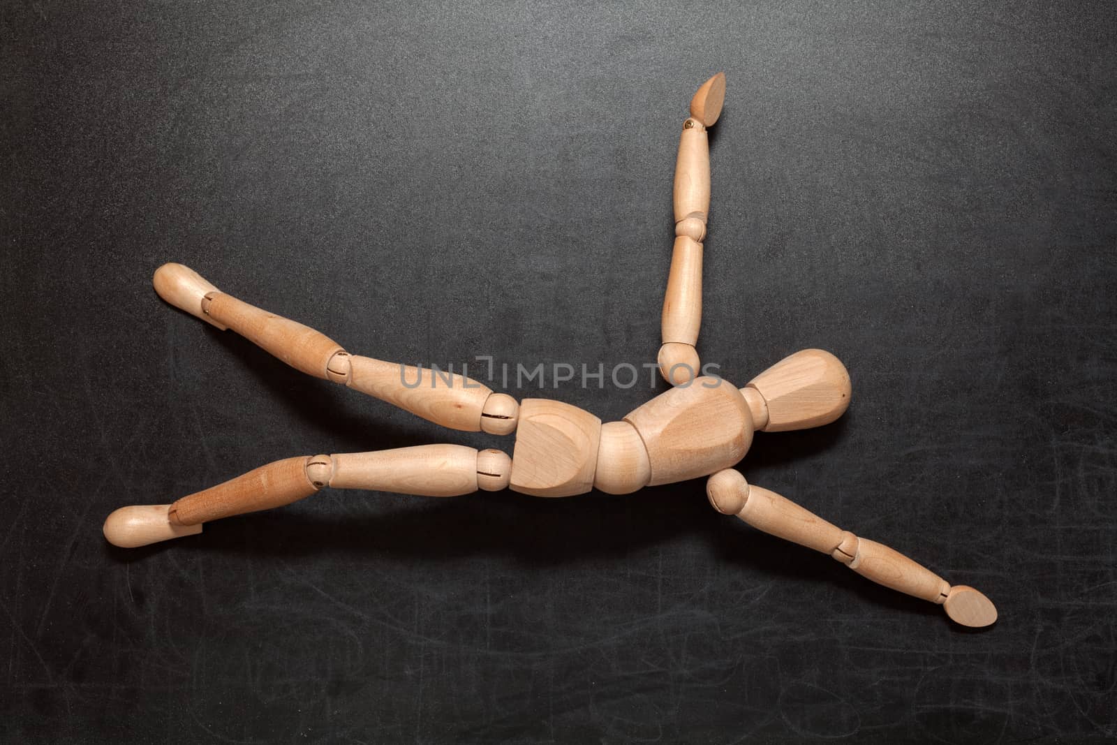 Lying dummy on a black background