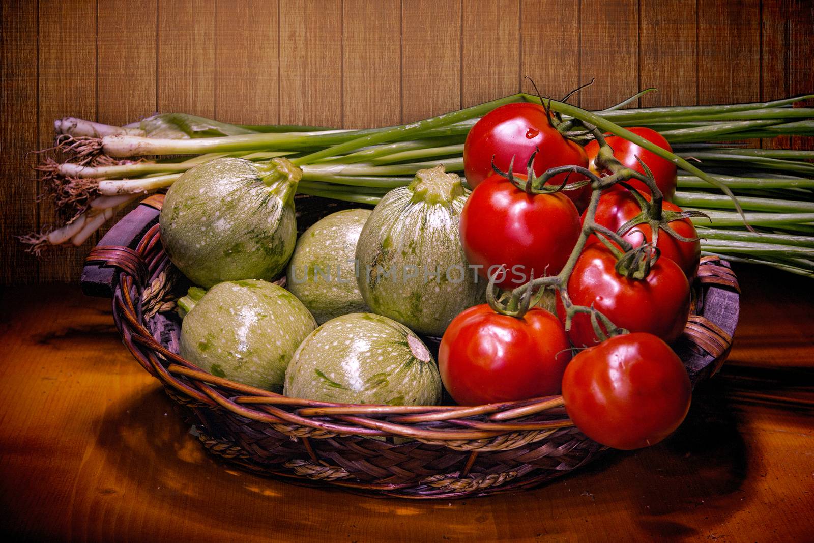 Basket with tomatoes, round zucchini and green onions by ben44