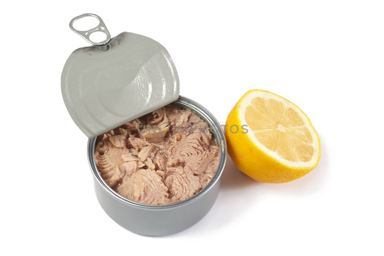 Open tuna tin with half lemon on a white background