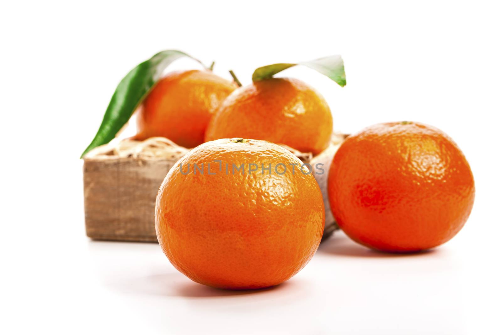 Ripe mandarines, Tangerines  with leaves on a white background. Tangerines