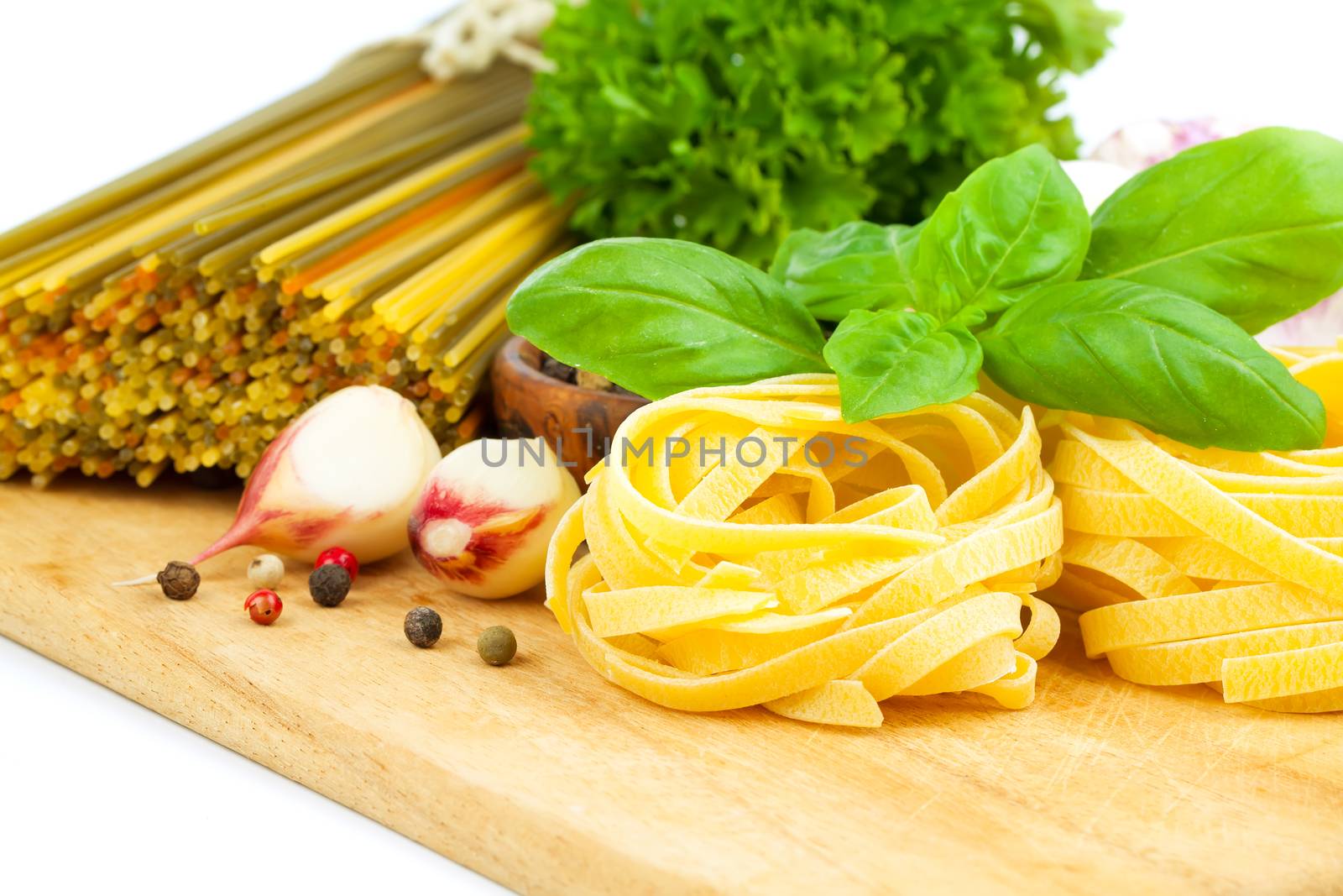 Italian pasta fettuccine nest isolated on white background by motorolka