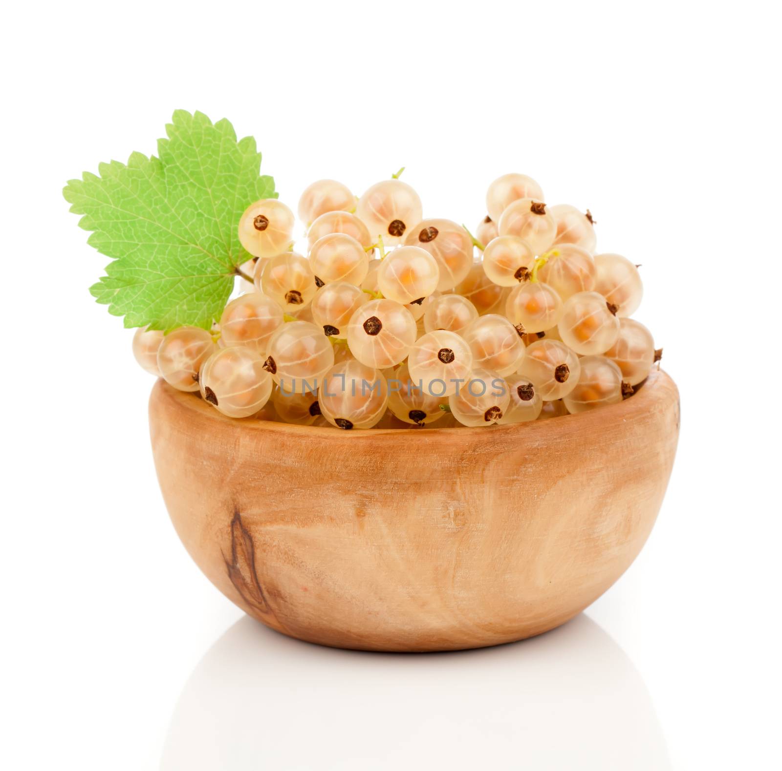 white currant fruit in wood bowls, over white background. by motorolka