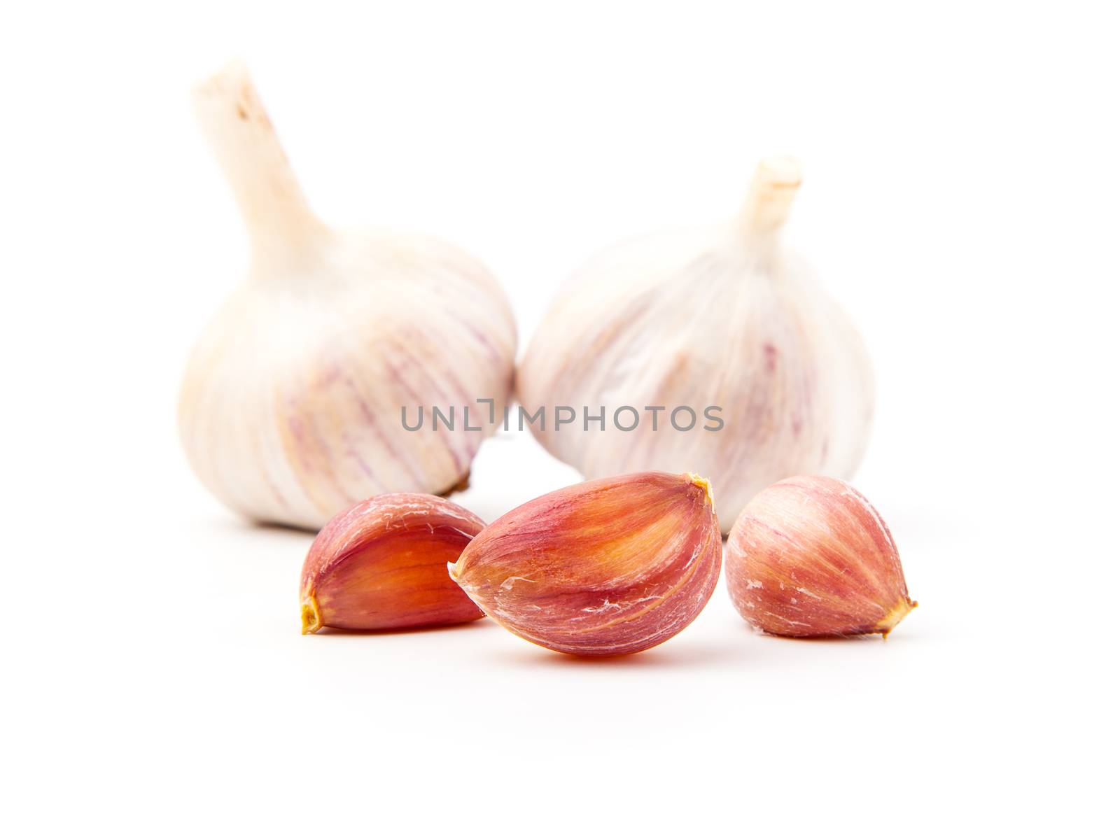 Fresh garlic isolated on white background by motorolka