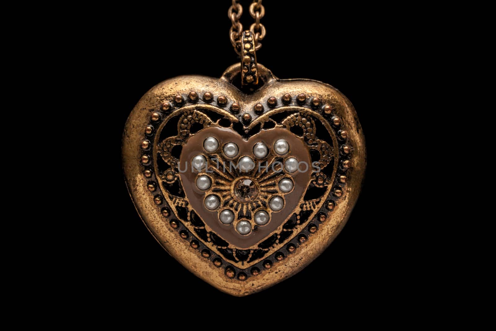 Heart-shaped necklace on black background