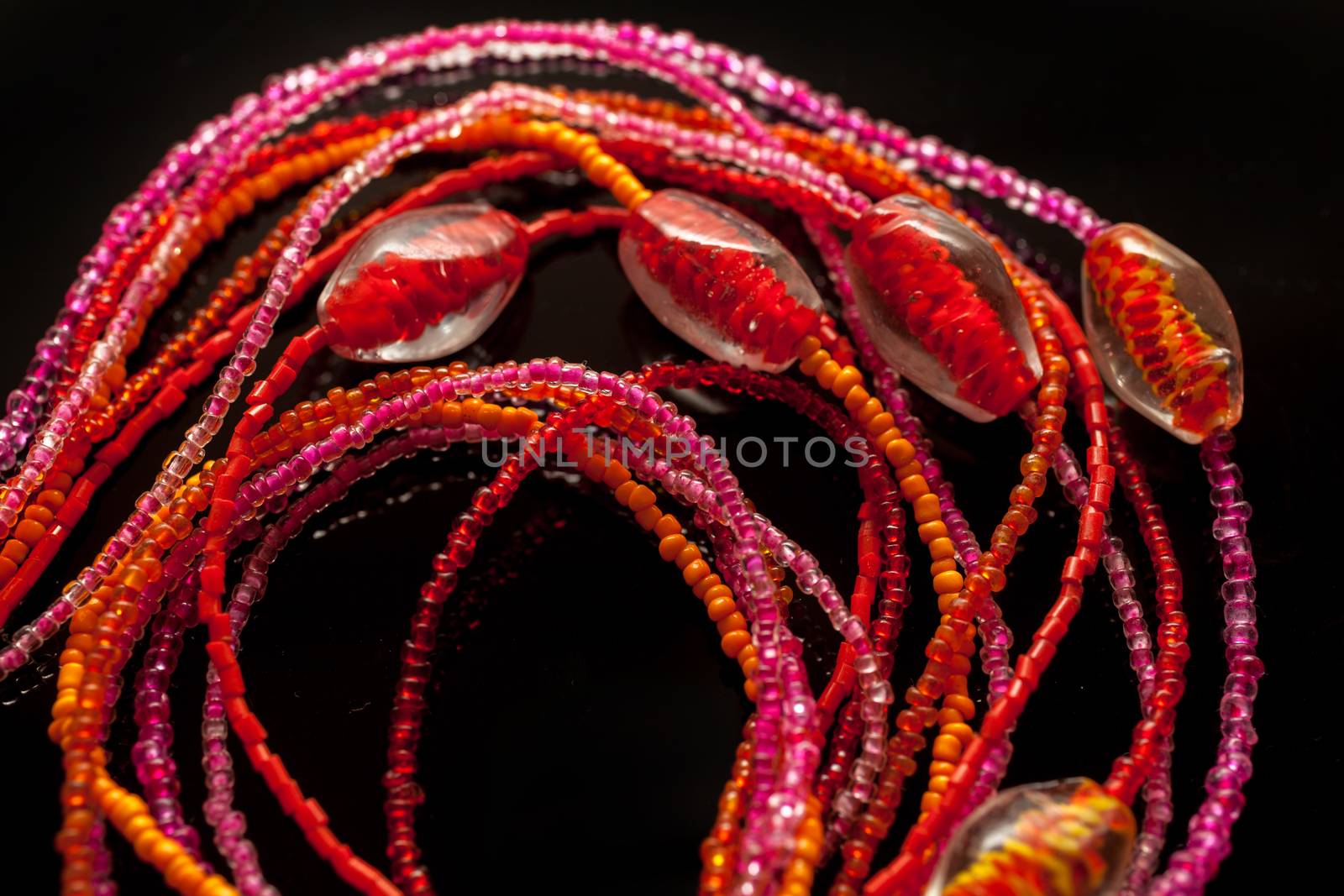 Jewelry of beads on black background