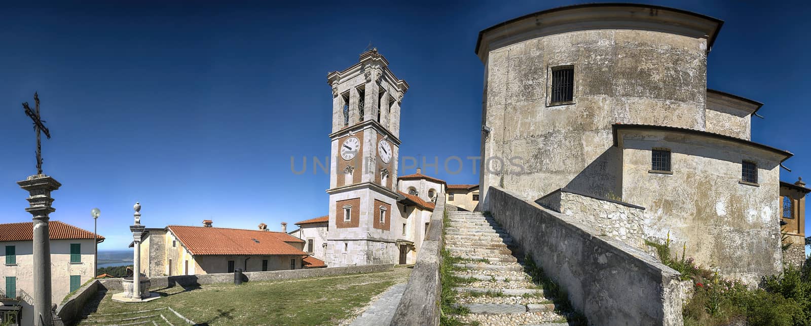 Square of the church, Sacred Mount of Varese in a limpid morning summer with blue sky in background