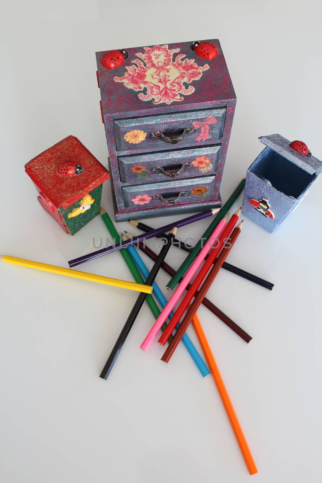 A handmade mini chest of three drawers decoupaged with floral vintage paper, handmade objects decorated using different techniques of decoupage by riccardofe