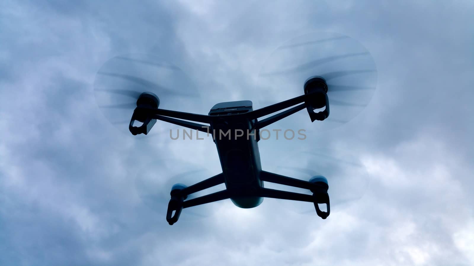 shadow drone flying in the cloudy sky