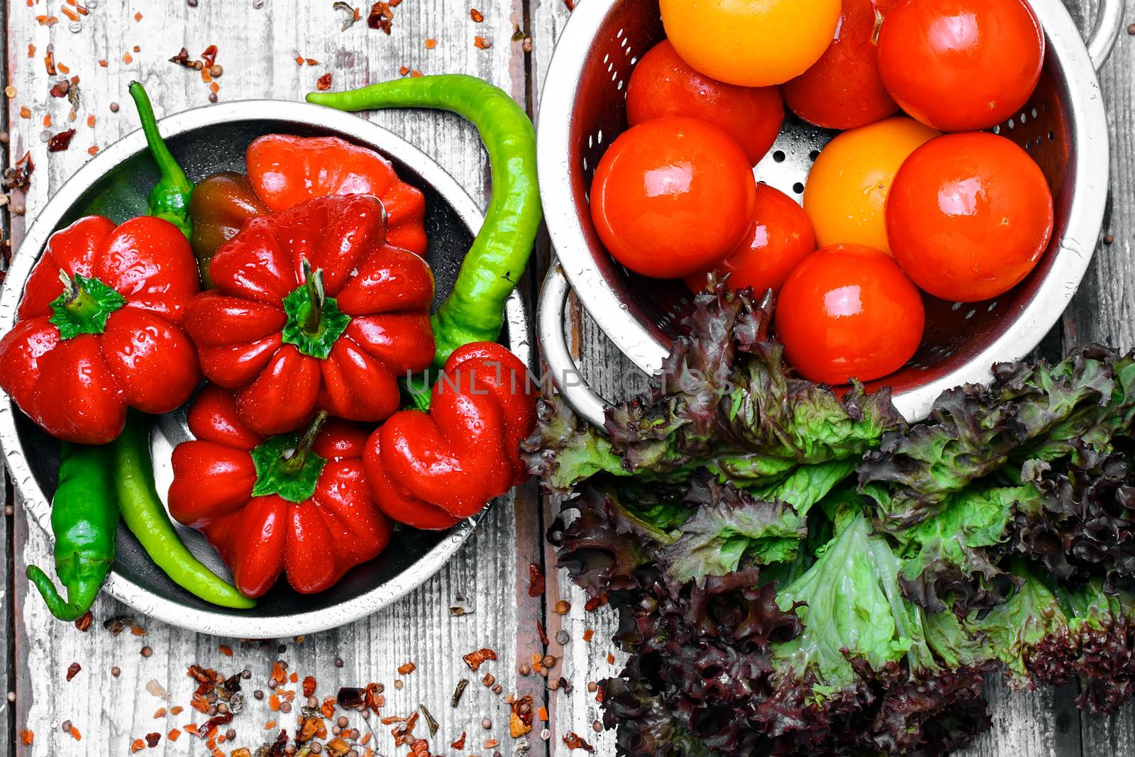 red pepper and paprika on iron plate with bright light background with spices