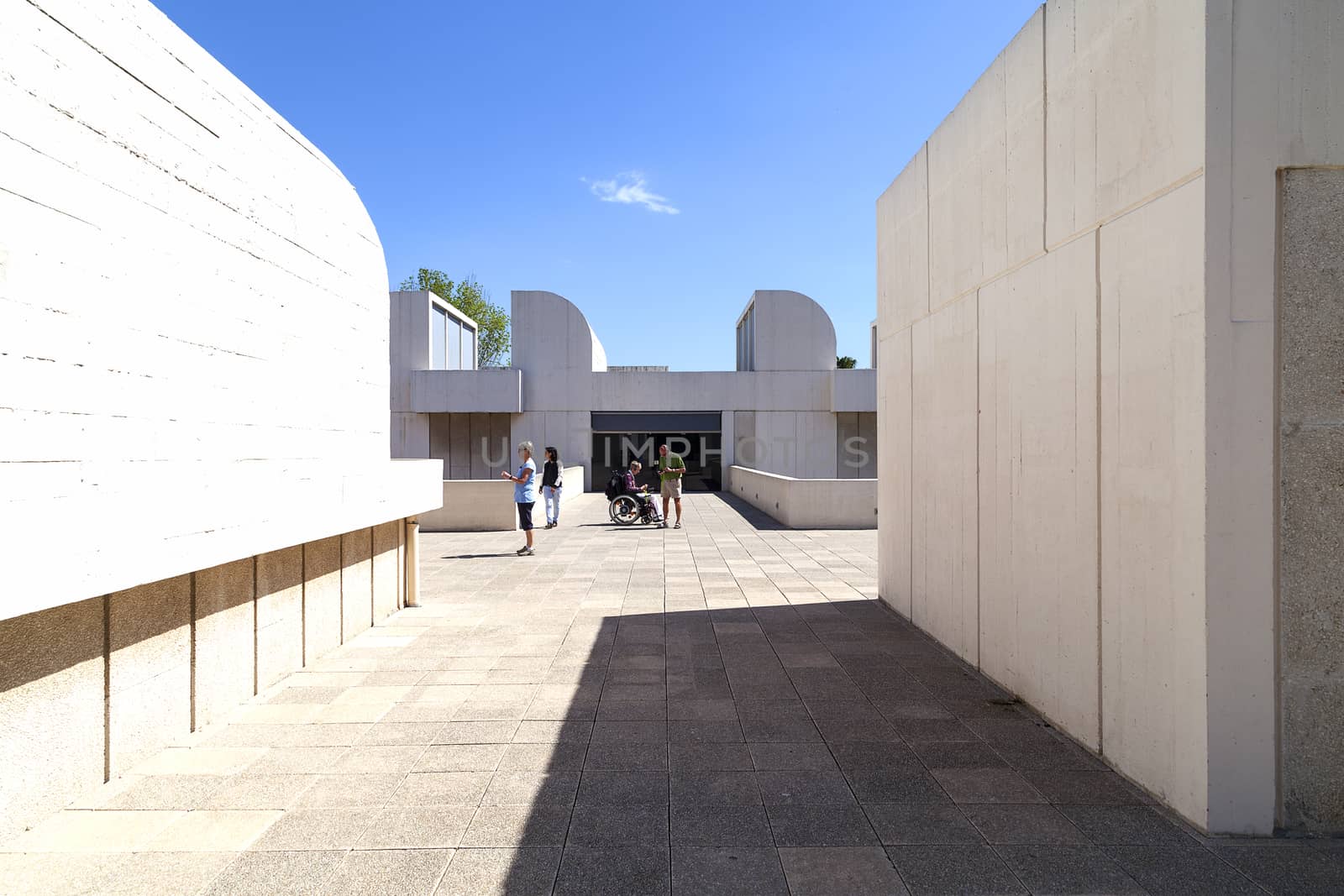 BARCELONA, SPAIN - MAY 12, 2016 :Tourists on the terrace of the building Joan Miro Foundation in a sunny day. Joan Miro Foundation, Centre of Studies of Contemporary Art  is a museum of modern art  located on the hill Montjuïc .It was founded in 1968.