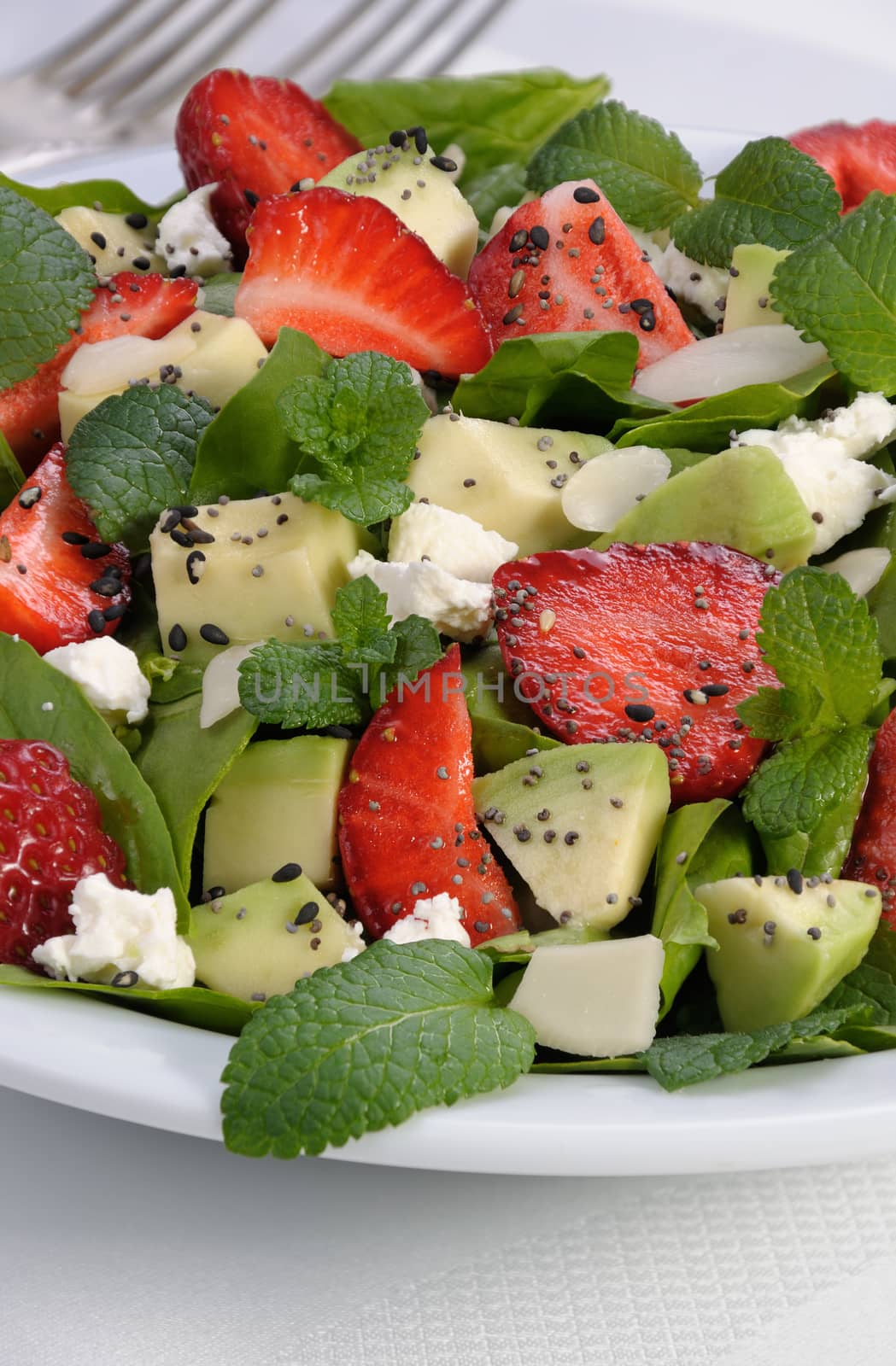 Salad spinach with strawberries, avocado, mint, ricotta and sesame,poppy seeds 