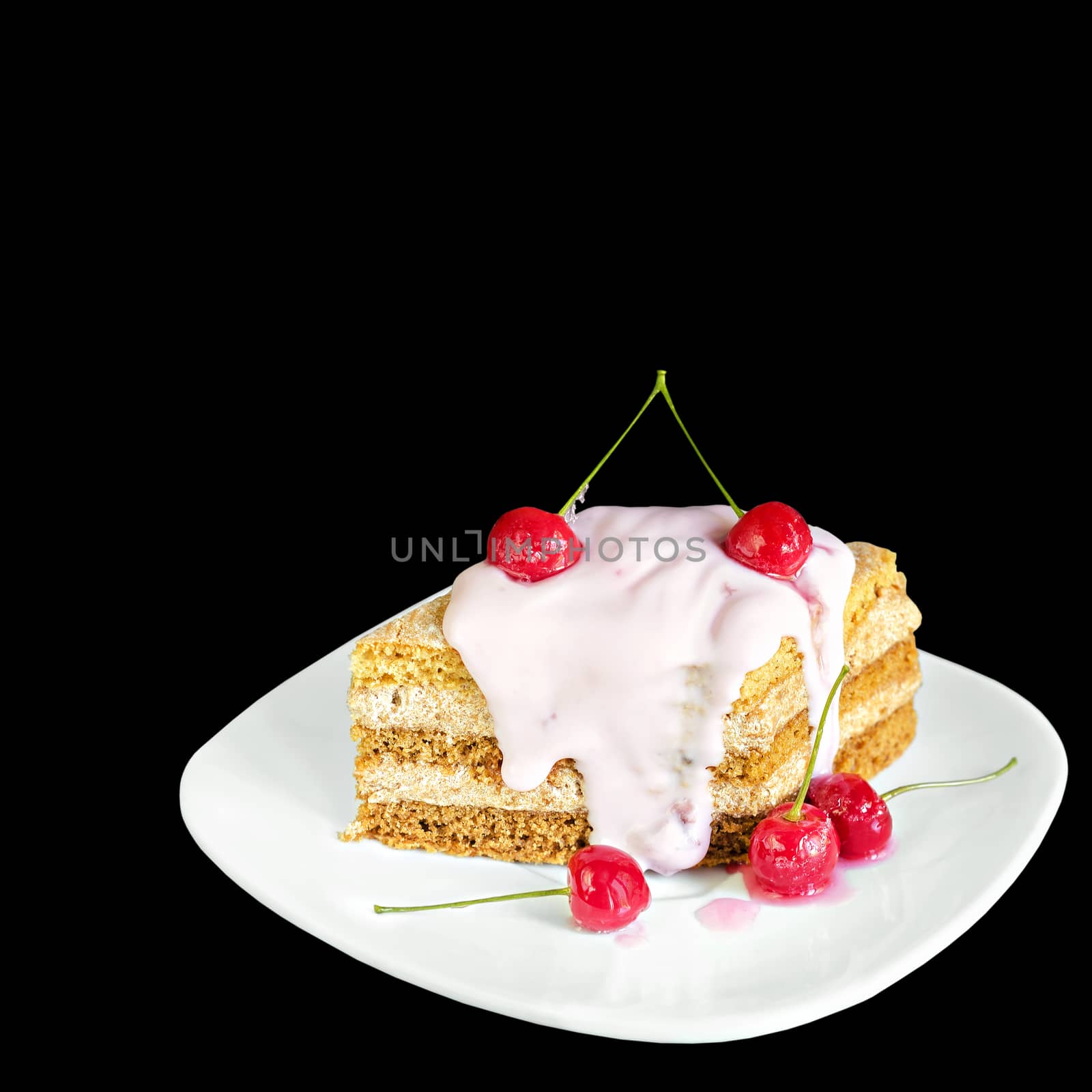 Piece of cake with cherries and yogurt on a plate, isolated on black background