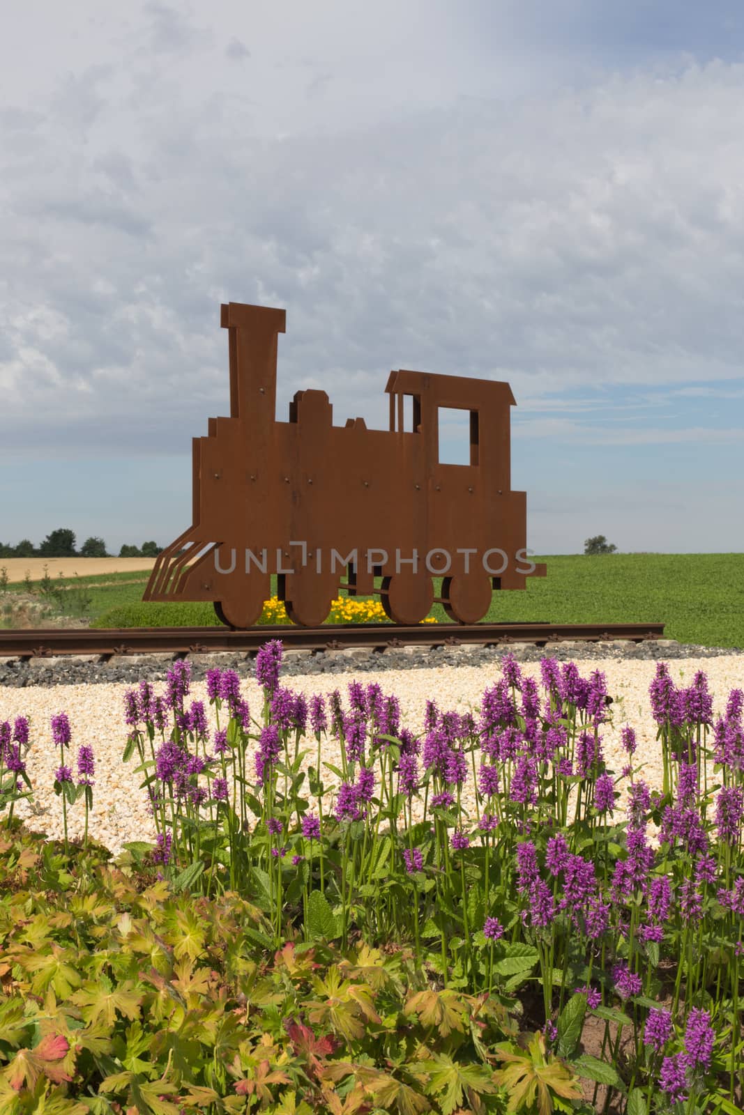 Silhouette of a steam locomotive, cloudy sky