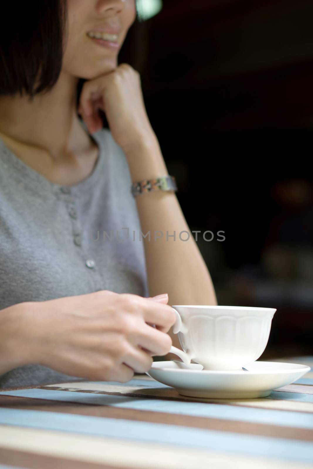 Girl's hands holding a cup of coffee