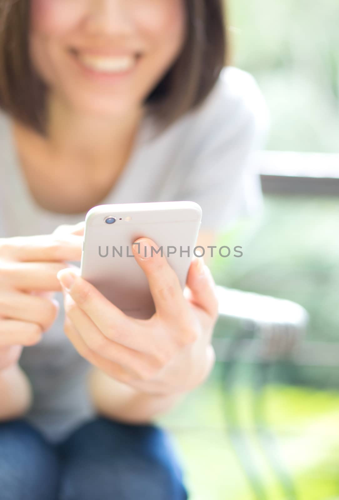 Close up of a woman using mobile smart phone