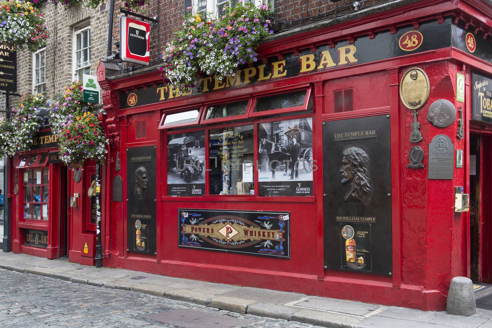 The famous Temple Bar Irish Pub in the Temple Bar District of Dublin in the Republic of Ireland. Temple Bar is an area on the south bank of the River Liffey. It is promoted as Dublin's cultural quarter and has a lively nightlife that is popular with tourists. Popular venues include The Palace Bar, The Temple Bar Pub, Oliver St.John Gogarty's and The Auld Dubliner.