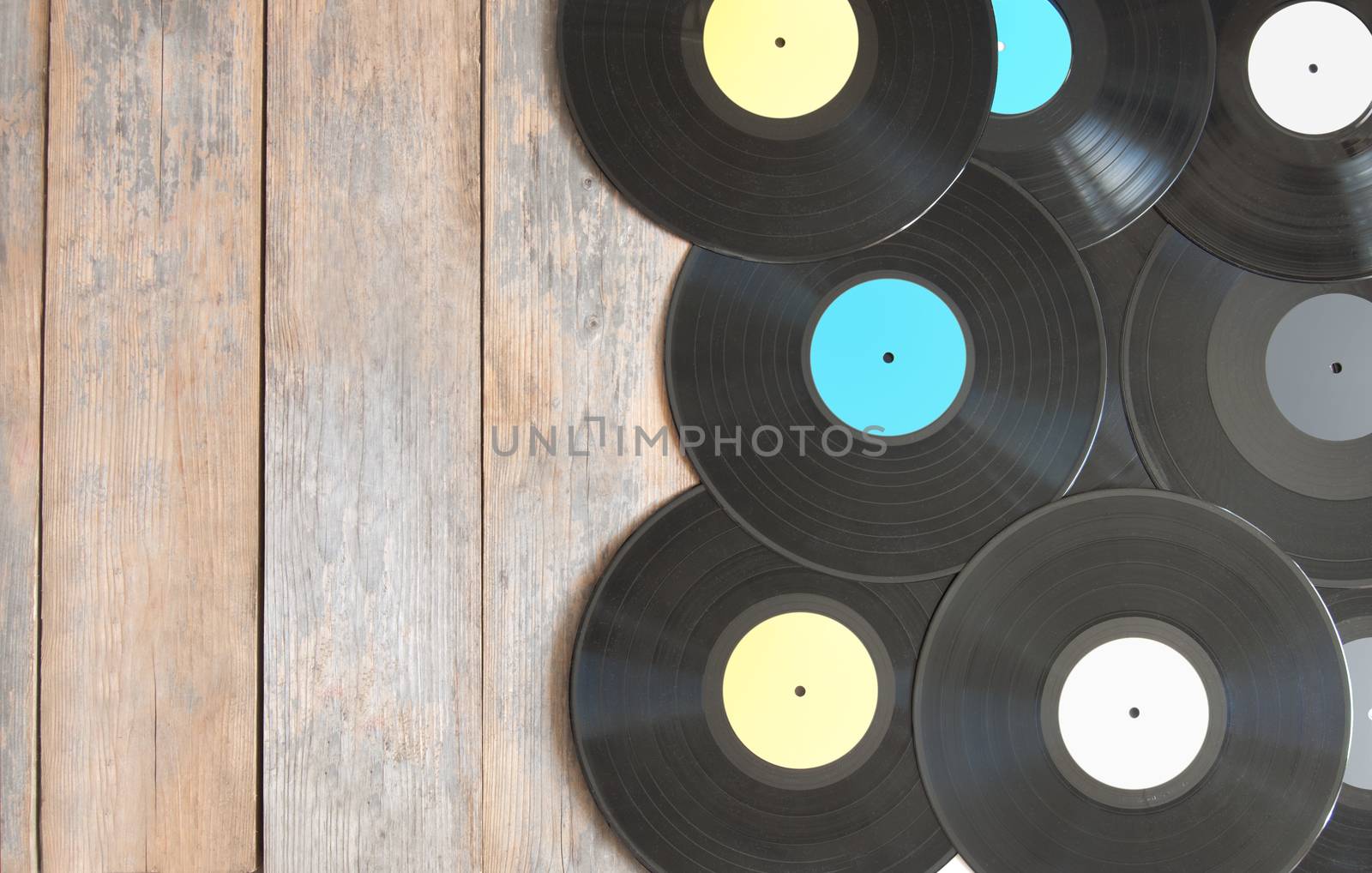 Vinyl records on top of wood with space for text 