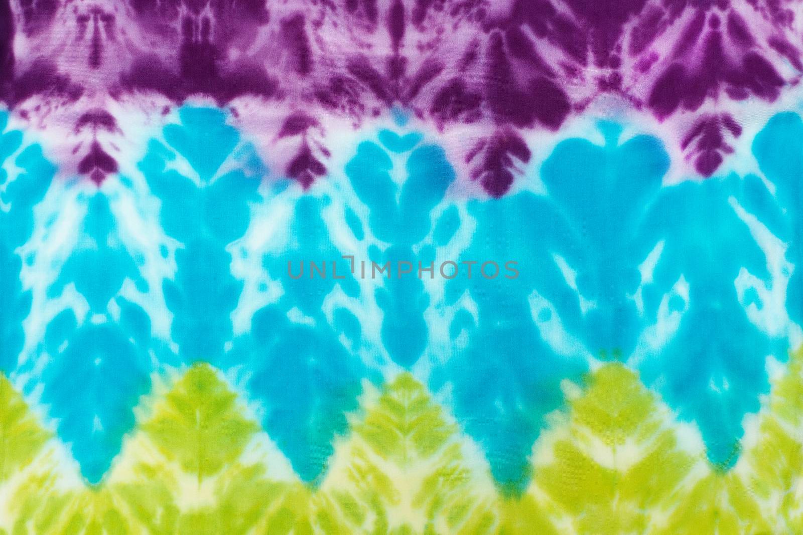 Blur fabric Tie dye bright colors texture background.