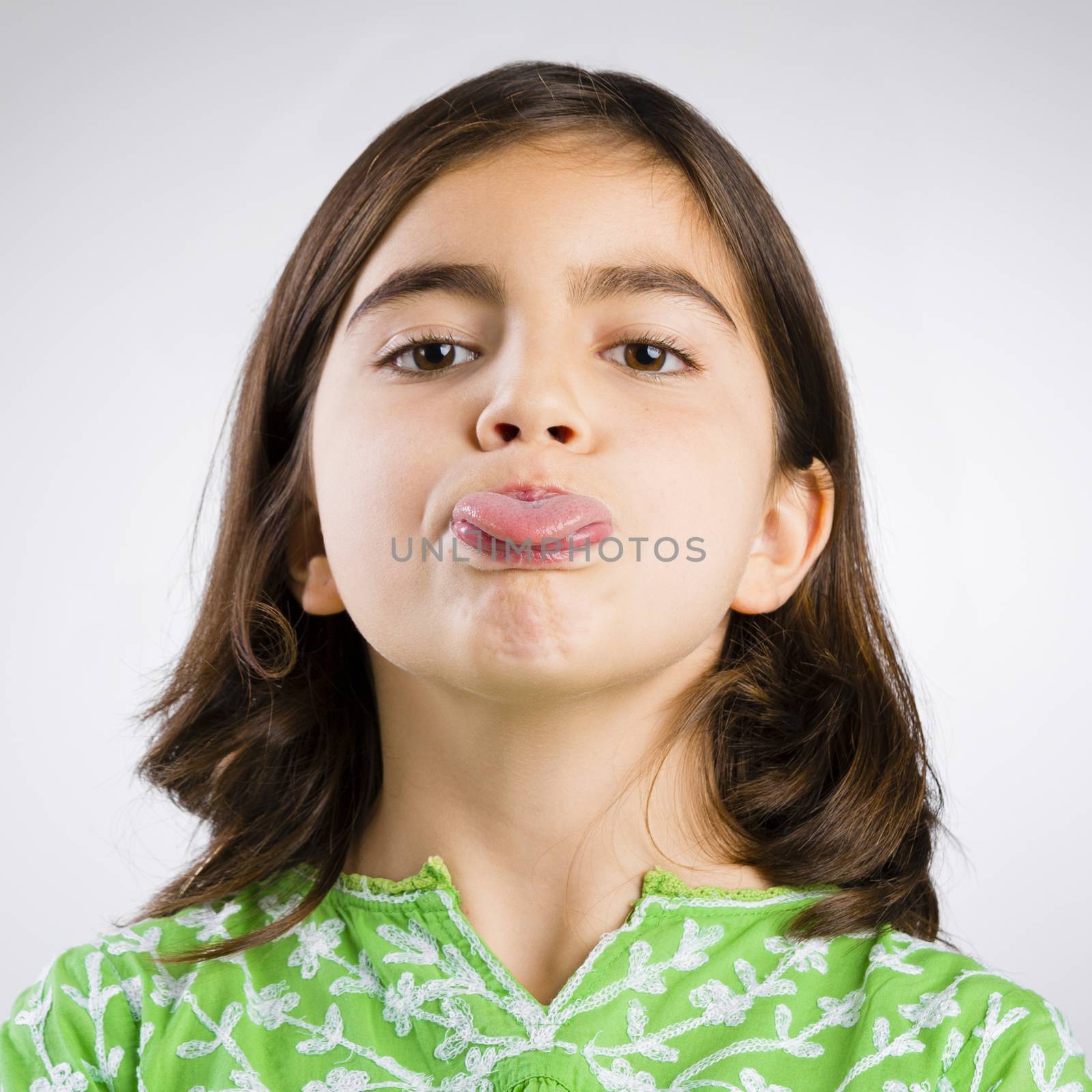 Portrait of a little girl making a funny expression