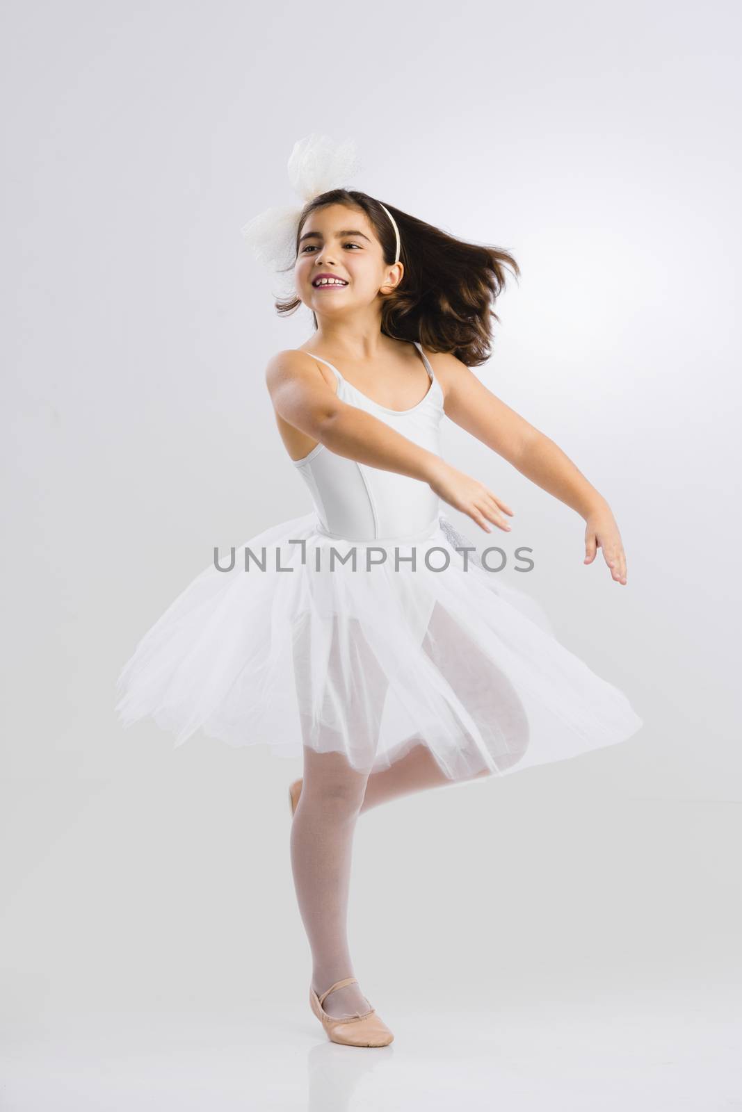 Beautiful little girl practicing ballet