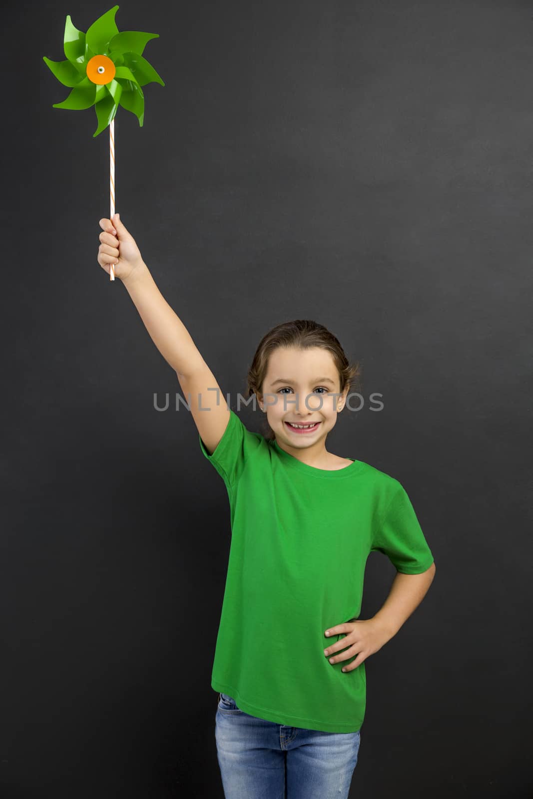 Little girl holding a windmill by Iko