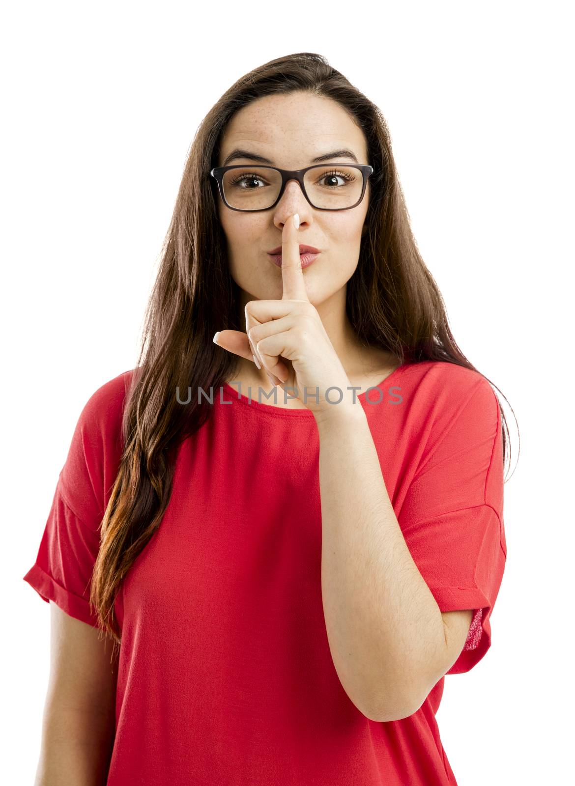 Lovey woman with her finger on her lips and asking for silence