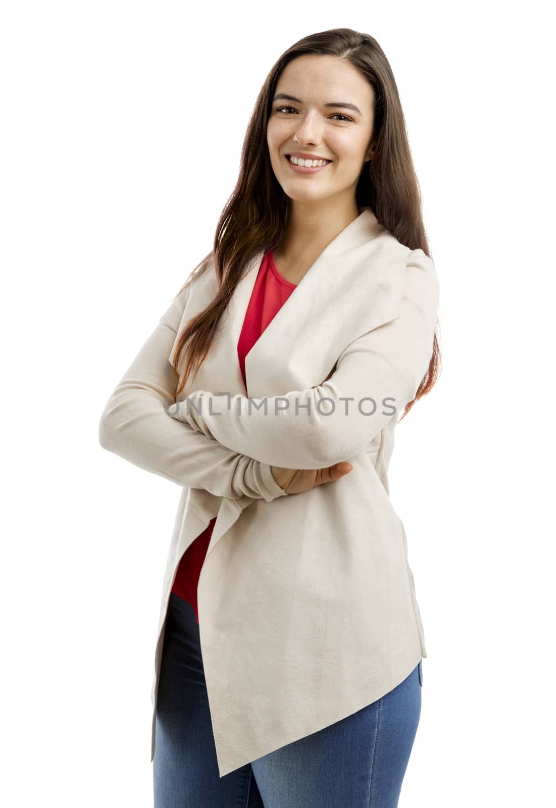 Lovely woman smiling at the camera with her arms folded