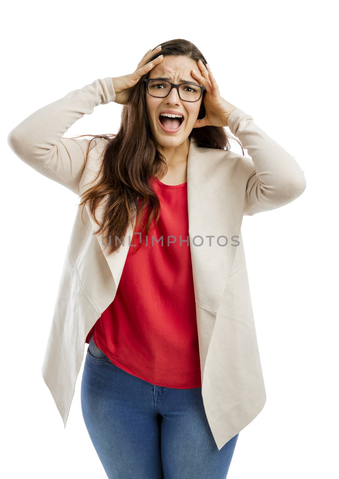 Portrait of a stressed woman with hands on head and yelling