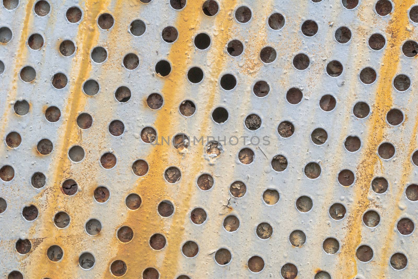 fragment of a rusty iron surface covered with old paint, which has long been under the influence of different climatic conditions