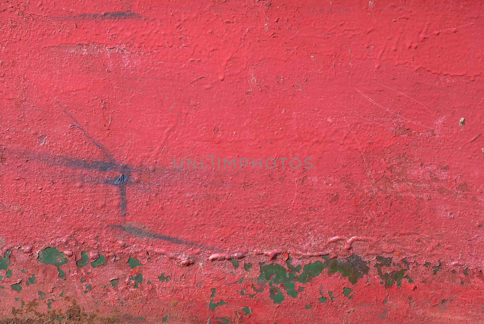 fragment of an iron surface is covered with red color paint, which has long been under the influence of different climatic conditions